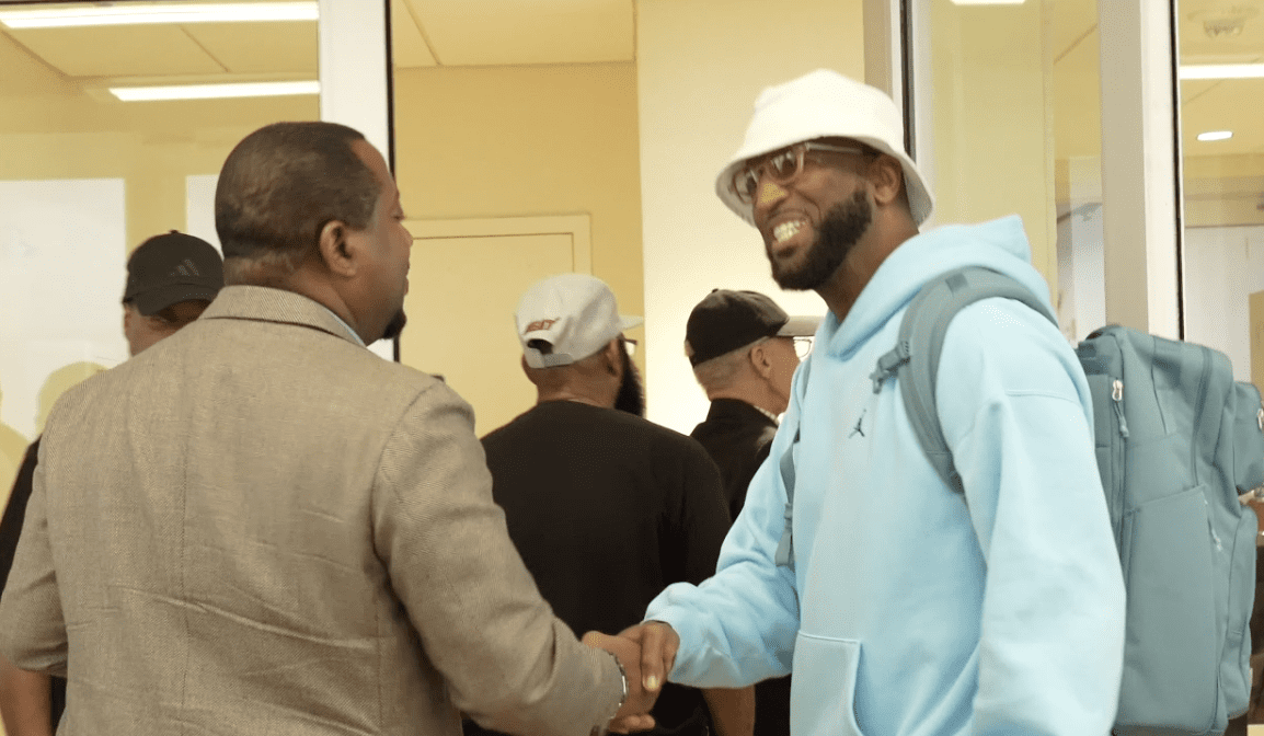 Rickey Smiley Shaking Hands